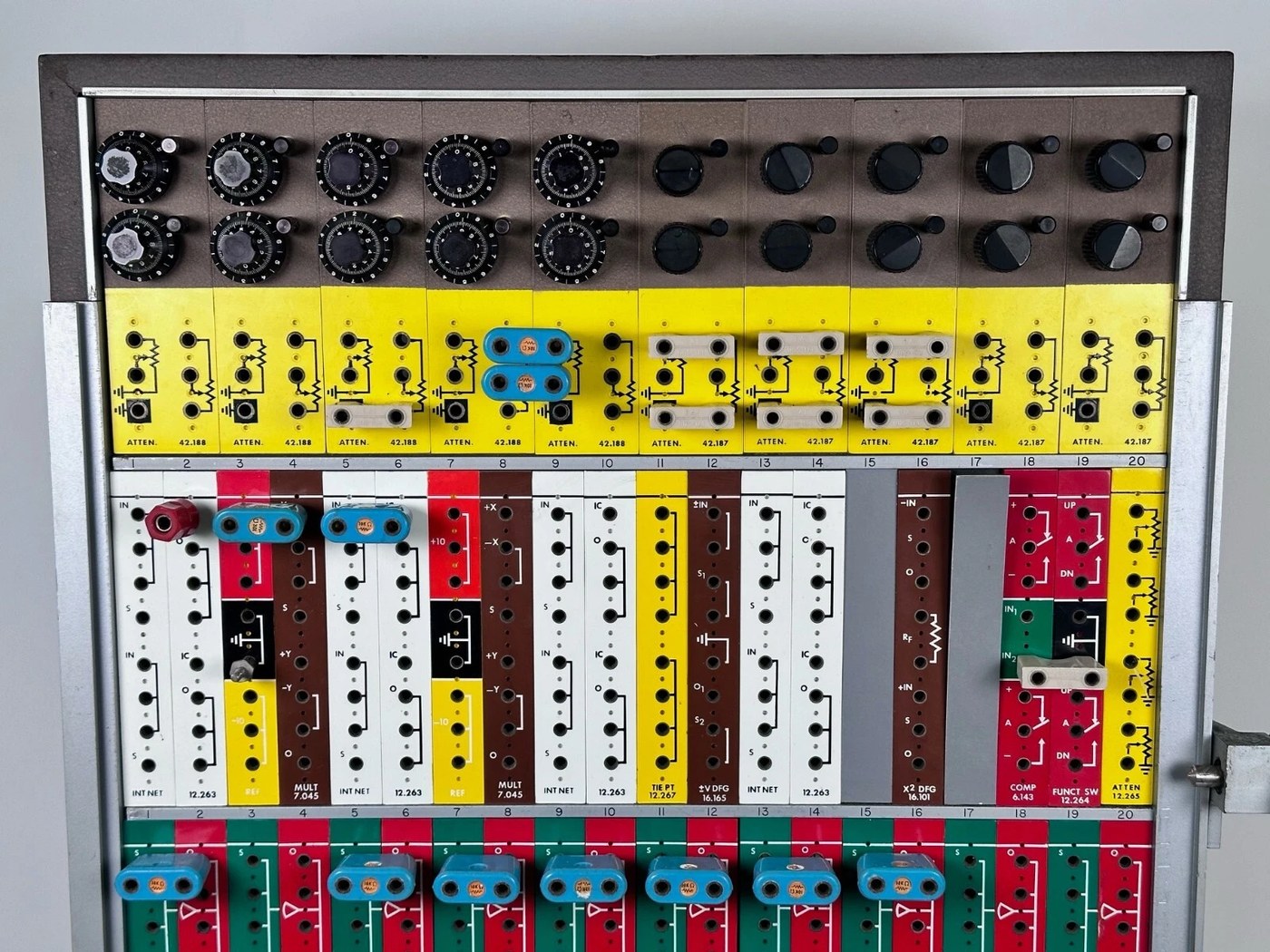 The front of a TR-10 console, showing the attenuator, non-linear and amplifier rows above the inclined control panel.