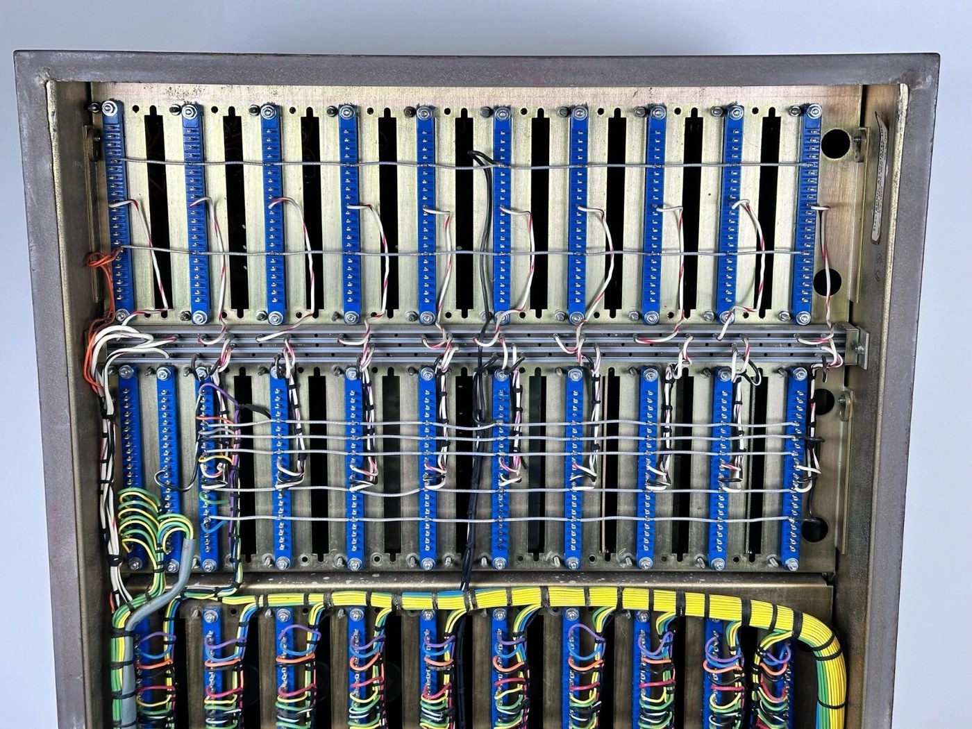 The rear of a TR-10 console with the cover removed, showing the backs of the plug-in modules and the wiring harness.