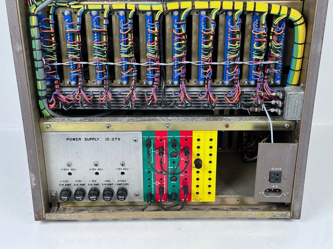 The lower rear of the console showing the plug-in power supply, labelled POWER SUPPLY 10.079.