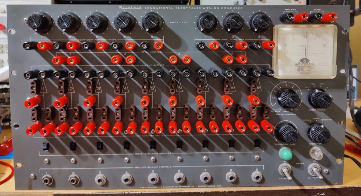 A second view of the front panel, with patch cords installed for a two-integrator problem; the coefficient pot knobs and mode switches are visible