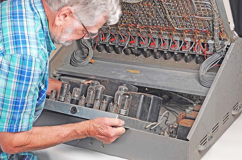 Condition on arrival — masking tape residue on the front panel, oxidized hardware