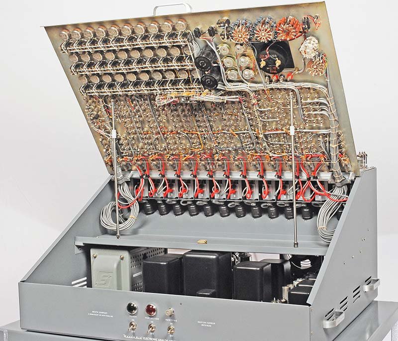 Interior of the cabinet after reassembly — power supplies and wiring harness